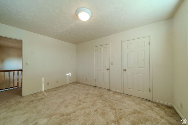 Unfurnished bedroom featuring baseboards and carpet flooring | Image 27