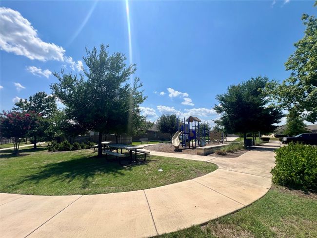 Community play area with a lawn | Image 36