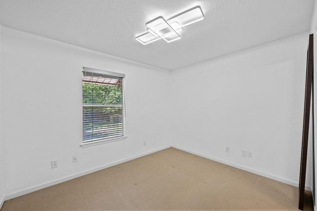 Carpeted spare room with baseboards and a textured ceiling | Image 7