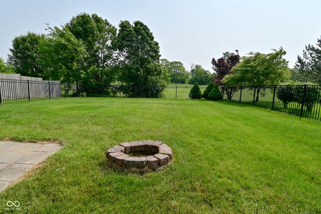 view of yard featuring an outdoor fire pit | Image 48