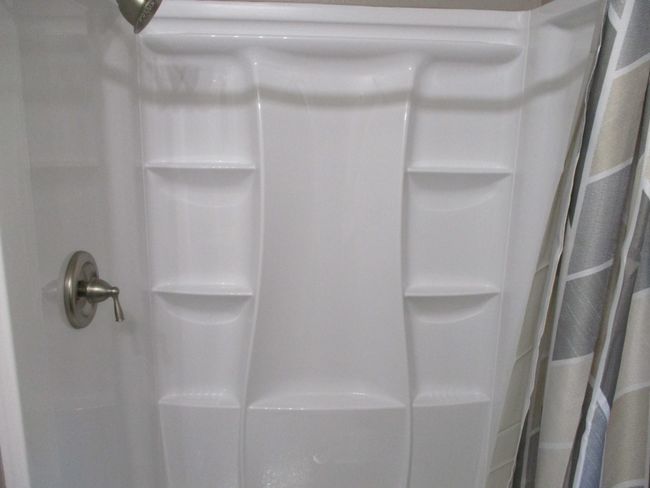 Bathroom view of a shower with curtain | Image 9