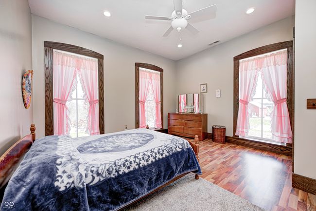 bedroom with recessed lighting, visible vents, ceiling fan, and wood finished floors | Image 40