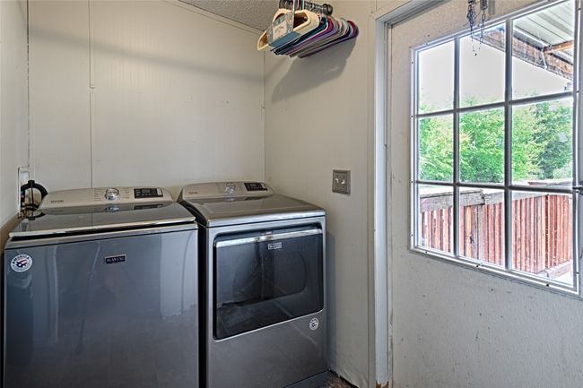 Laundry room with washer and clothes dryer | Image 21