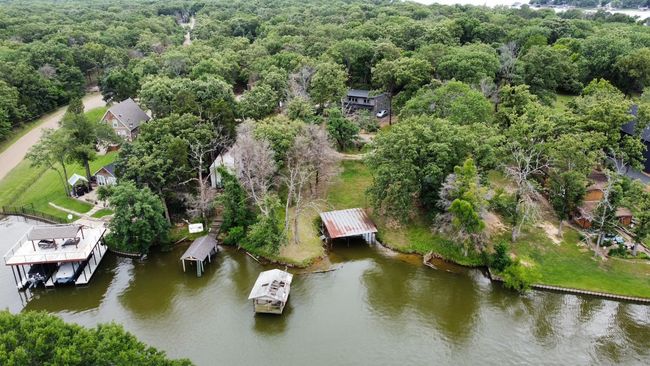 Lakeview of property and surrounding area featuring lake and a forest | Image 5