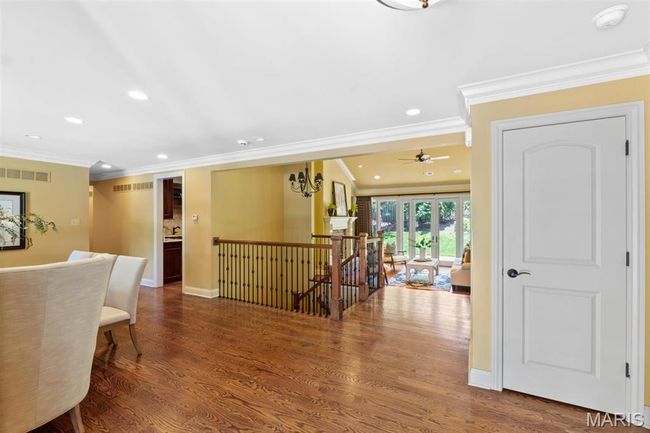 Hall featuring an upstairs landing, ornamental molding, recessed lighting, and wood finished floors | Image 8