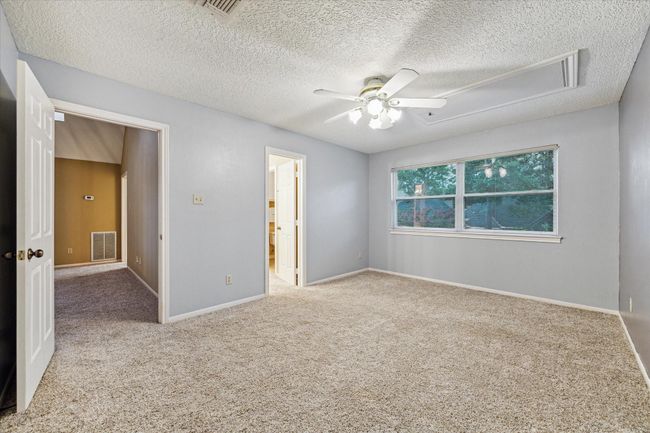 This larger 15’x11’ secondary bedroom also overlooks the back yard and has a roomy closet. | Image 28