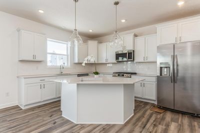 (Photo of an inventory home, actual features will vary) Thoughtfully-designed space with the perfect amount of natural light to enhance the heart of the home. | Image 3