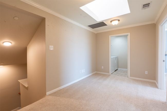 Upstairs loft living area, naturally skylight lit, is so cozy and cheery. | Image 12