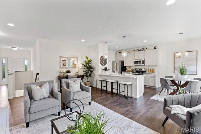 Living room featuring a chandelier, dark wood-style flooring, recessed lighting, and baseboards | Image 14