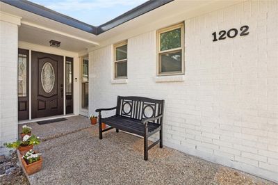 Welcoming front entrance of this Charleston/Ranch style home. | Image 2