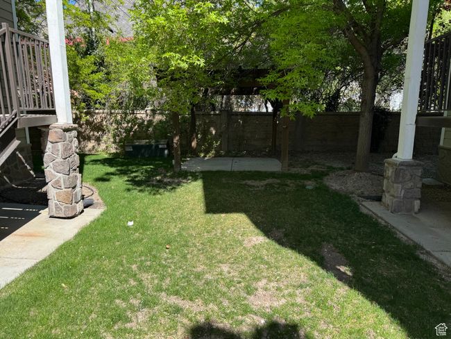 View of yard with a fenced backyard | Image 13