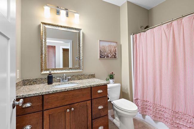 Additional Full bathroom has heated tile floors and granite countertops | Image 17