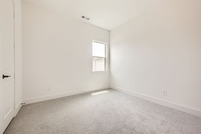 Unfurnished room featuring light colored carpet and baseboards | Image 23
