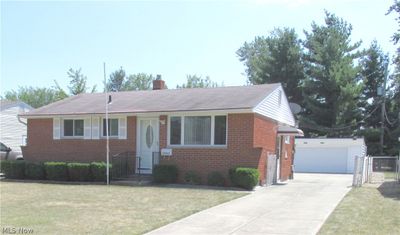 Beautiful Brick Ranch with 2 car garage and a front lawn | Image 1