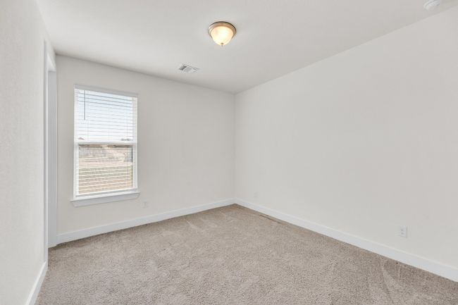 Carpeted empty room with visible vents and baseboards | Image 25