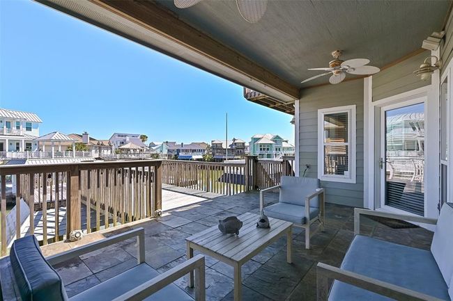 Large covered seating area with relaxing canal views. | Image 7