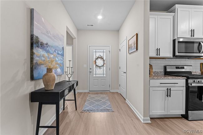 Entrance foyer with light wood-type flooring and baseboards | Image 7
