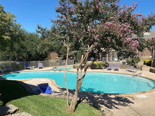 Community pool featuring fence and a patio area | Image 19