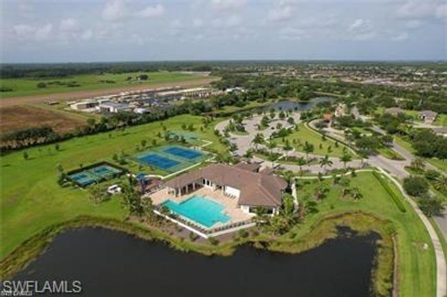 Aerial view of property's location featuring a pool area and a large body of water | Image 27