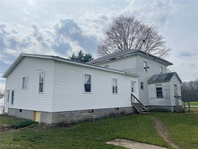 Front view of property with addition and a lawn | Image 1