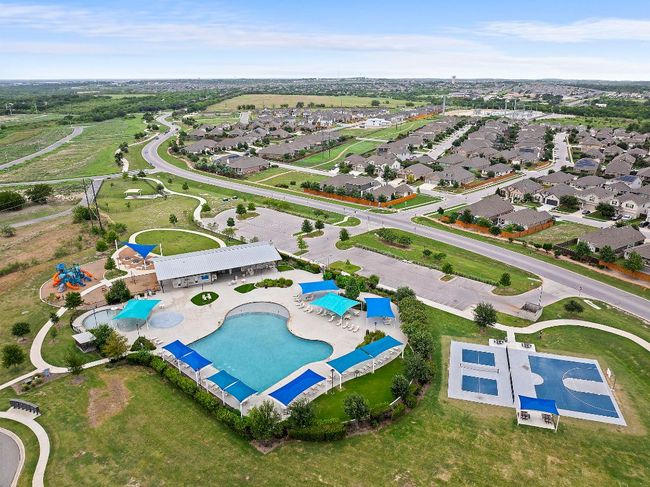 This home is located Just steps away from the amenity center, offering effortless access to the pool, playground, park, and more. | Image 27