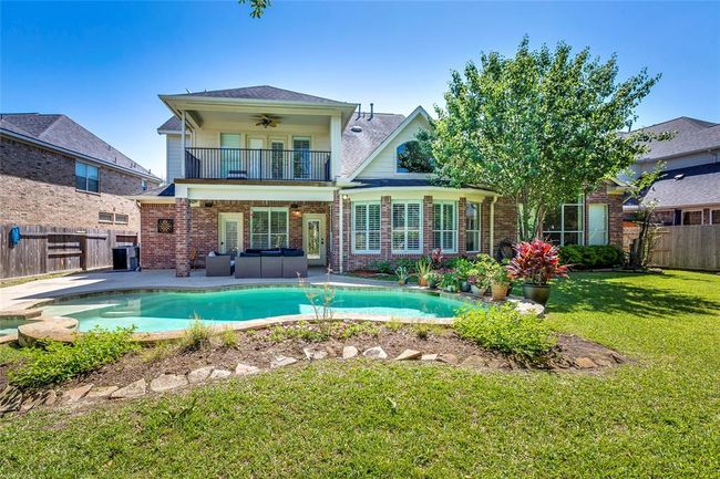 Wonderful back yard with pool & heated spa, great neighborhood views from balcony upstairs | Image 36