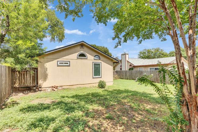 View of property exterior featuring a fenced backyard | Image 18