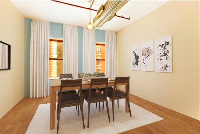 Dining room with wood finished floors | Image 9