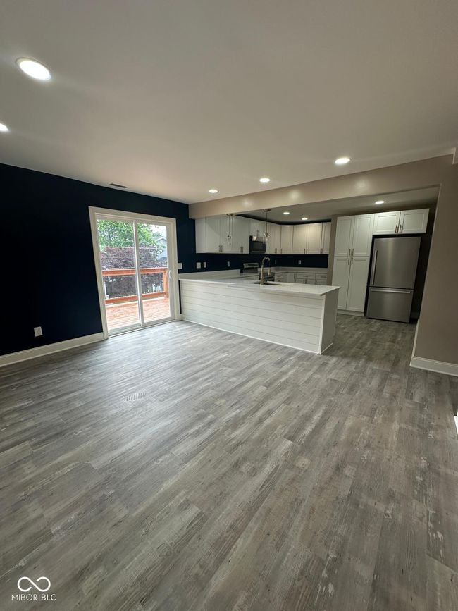 Unit 2 - unfurnished living room featuring recessed lighting and wood finished floors | Image 20
