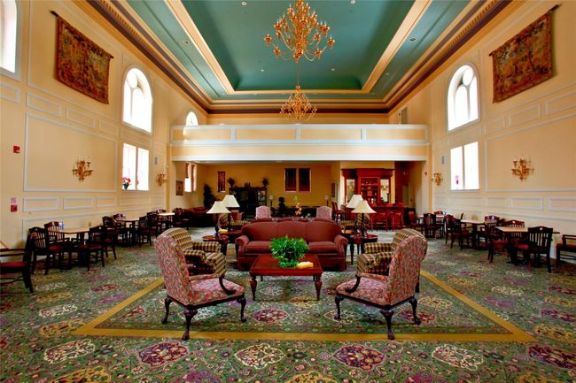 Building lobby with a high ceiling, a decorative wall, and crown molding | Image 45