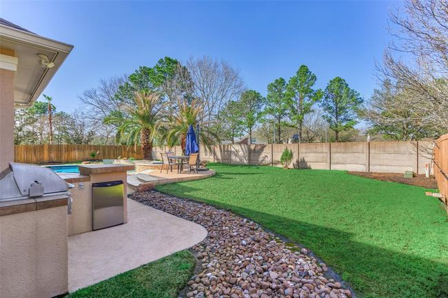 Tranquil backyard oasis with lush greenbelt views. | Image 30