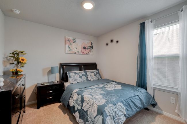 Bedroom featuring light colored carpet and baseboards | Image 23