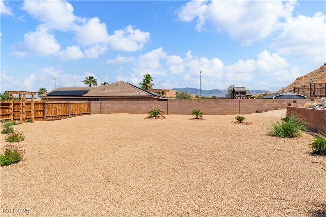 Fenced backyard with a mountain view | Image 42