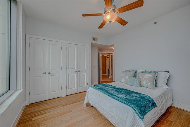 Bright master bedroom with double closets and abundant natural light. | Image 11