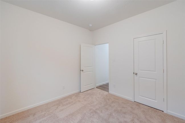 Unfurnished bedroom featuring carpet and baseboards | Image 7