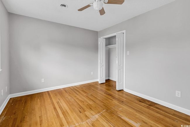 Unfurnished bedroom with light wood-type flooring, a closet, and ceiling fan | Image 24