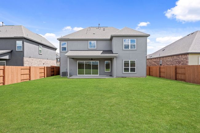 Backyard is securely fenced in for privacy. | Image 12