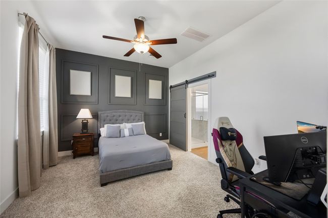 Your private retreat awaits in the spacious primary suite, where soft tones, natural light, and a relaxing ambiance invite you to unwind at the end of the day. | Image 17