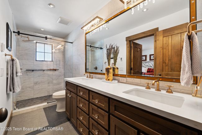 Double sink vanity with extra storage. | Image 23