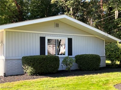 View of property exterior featuring a lawn | Image 3