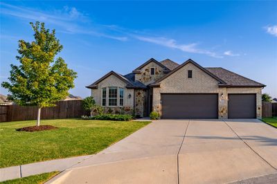 View of front of house and three car garage | Image 1