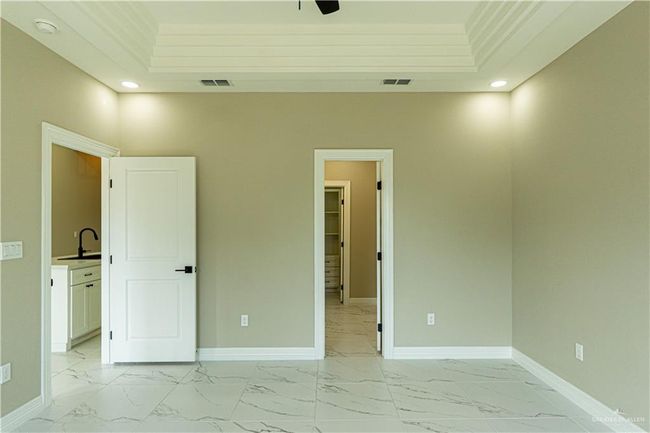 Unfurnished bedroom featuring marble finish floor, visible vents, and baseboards | Image 7