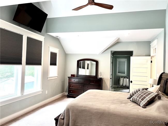 Primary Upstairs Bedroom featuring lofted ceiling, and a ceiling fan | Image 29