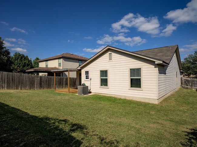 Rear view of house featuring a fenced backyard. | Image 27
