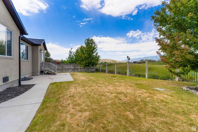 Fenced backyard looking onto The Ranches Golf Course | Image 38