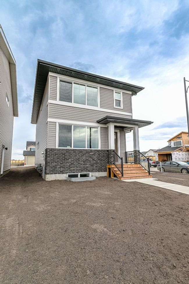 8729 Copperwood Road, Home with 3 bedrooms, 2 bathrooms and 2 parking in Grande Prairie AB | Image 2