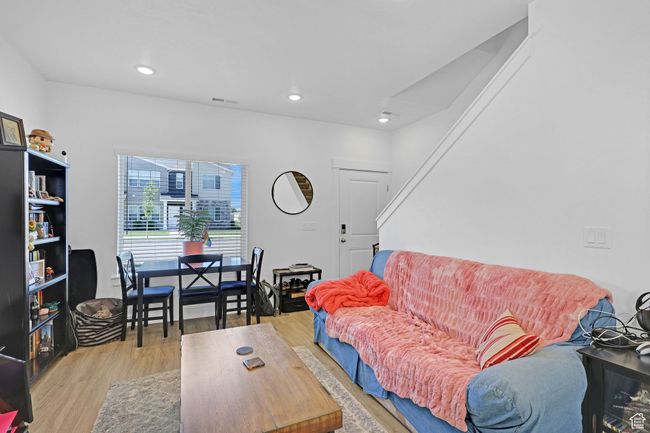 Living room featuring wood finished floors and recessed lighting | Image 6