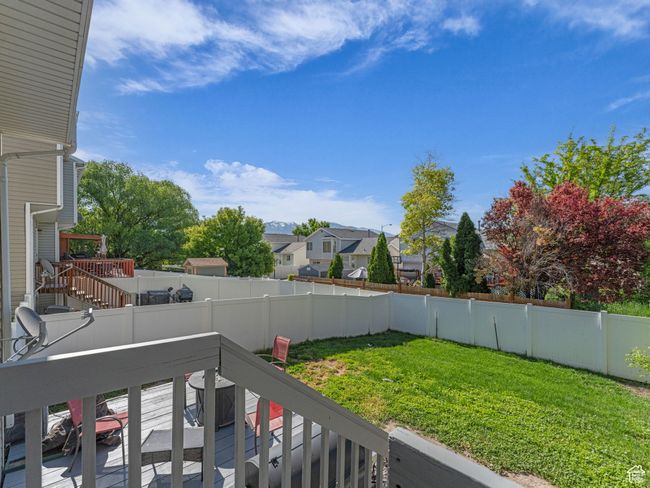 View of yard featuring a deck, a residential view, and stairway | Image 38