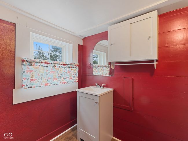 bathroom featuring wood finished floors and vanity | Image 30