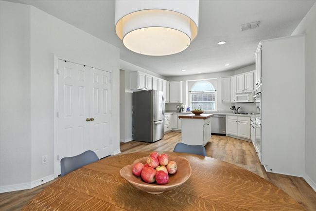 Dining area with light wood-type flooring and recessed lighting | Image 17